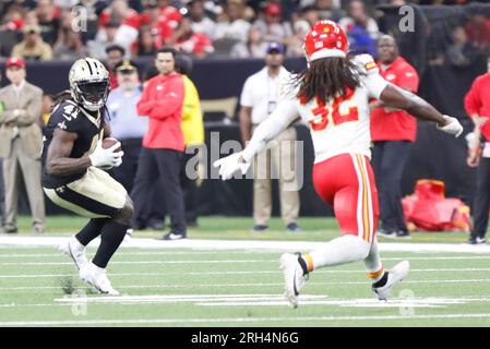 New Orleans, USA. 13th Aug, 2023. New Orleans Saints running back Alvin Kamara (41) run for some yards after the catch while being pursued by Kansas City Chiefs linebacker Nick Bolton (32) during a National Football League preseason game at the Caesars Superdome in New Orleans, Louisiana on Sunday, August 13, 2023. (Photo by Peter G. Forest/Sipa USA) Credit: Sipa USA/Alamy Live News Stock Photo