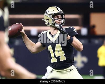 Jake Haener of the New Orleans Saints drops back to pass during