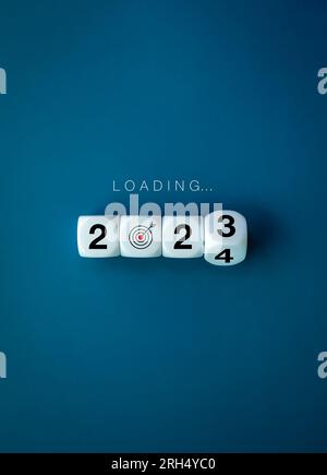 Loading to Merry christmas and happy new year 2024 banner background. Loading, text appears on white flipping blocks with 2023 change to 2024 year num Stock Photo