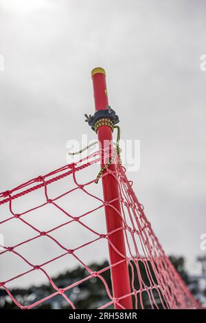A Detail of orange plastic barrier on ski slope Stock Photo