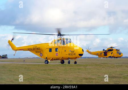 Westland Whirlwind, HAR 10, XJ729, and Sea King, HAR 3, XZ594, Disbandment of No 22 Sqn, RAF Valley, Anglesey, North Wales. Stock Photo