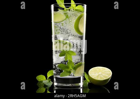 A detailed mojito glass filled with refreshing ingredients, contrasted against a pure black background. Stock Photo