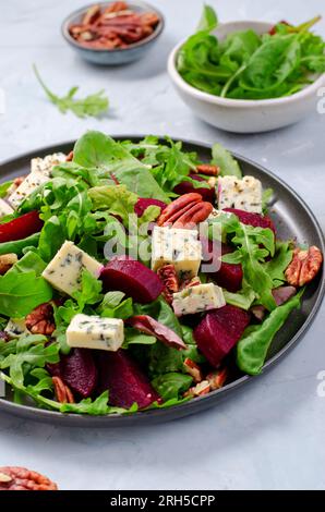 Beetroot Salad with Blue Cheese, Nuts and Salad Mix over Bright Background, Tasty Appetizer Stock Photo