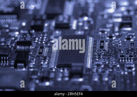Intricate circuit board with computer hardware, showcasing complexity of electronics industry. Stock Photo