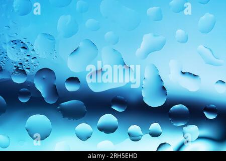 Water drops on a glass surface close up Stock Photo