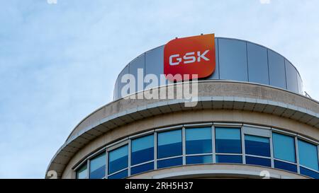 Sign and logo on the building housing the French headquarters of GSK, formerly GlaxoSmithKline, a British multinational pharmaceutical company Stock Photo