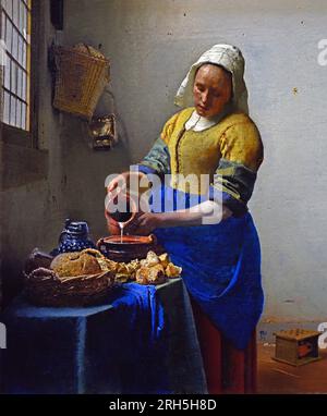 The Kitchen Maid Milkmaid -  Het melk meisje (1658-1660)  Johannes Jan Vermeer  Dutch, Delft 1632–1675 Delft Netherlands  ( Dutch painter in the Golden Age,  one of the greatest painters,   17th century. preferred timeless, subdued moments, remains enigmatic,  inimitable colour scheme and bewildering light content) Stock Photo