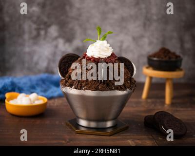 Korean shaved ice dessert with sweet toppings,  chocolate cookies Bingsu Stock Photo