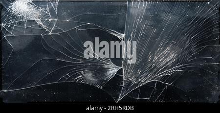 Broken glass texture on black background Stock Photo