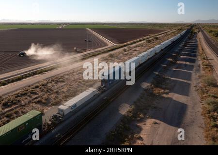 Aerial view of farmland with train running through it Stock Photo
