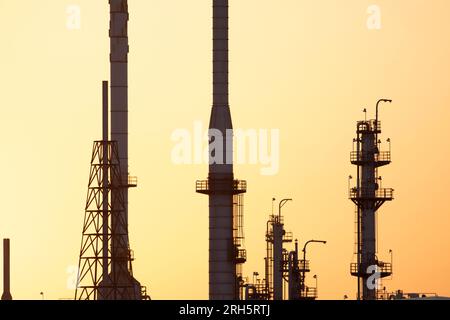 Close up view of industry stacks towers at sunset Stock Photo