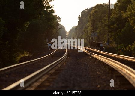 Long view of train tracks vanishing into horizon Stock Photo