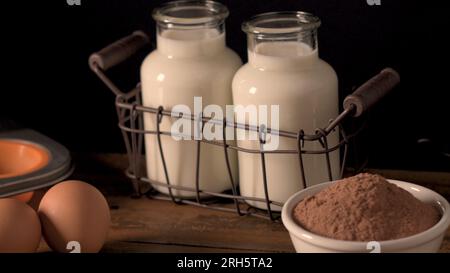 Muffins baking ingredients on wooden table. Stock Photo