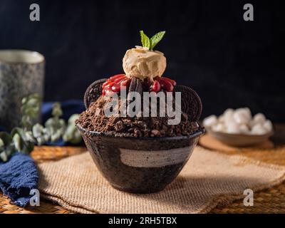 Korean shaved ice dessert with sweet toppings,  chocolate cookies Bingsu Stock Photo