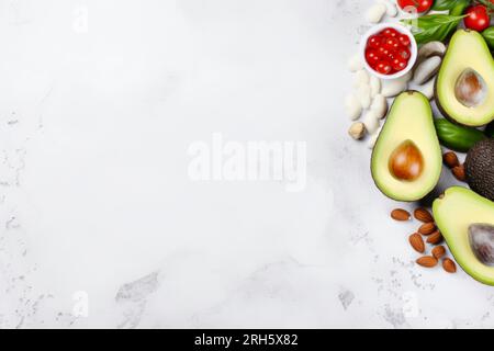 An overhead shot capturing a diverse selection of healthy foods, leaving room for text. Stock Photo