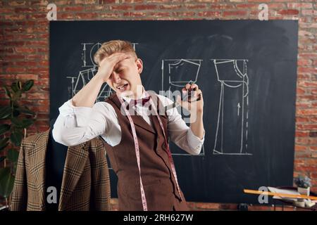 Unsuccessful line. Young emotional fashion design, man feeling unhappy and sad. Mistakes in sketches Stock Photo