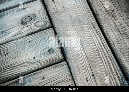 Close up of weathered wooden planks in a deck floor Stock Photo