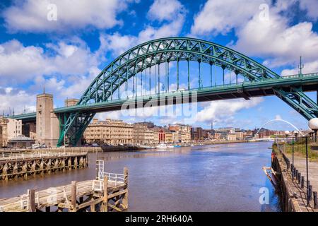 Newcastle upon Tyne, UK - the Tyne Bridge and the River Tyne, in the North East of England, UK, on a bright spring day, with historic waterside .... Stock Photo