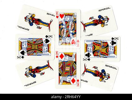 Vintage playing cards showing a display of kings and jokers. Stock Photo