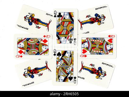 Vintage playing cards showing a display of queens and jokers. Stock Photo