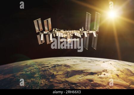 International Space Station on background of rising Sun. Elements of this image furnished by NASA. Stock Photo
