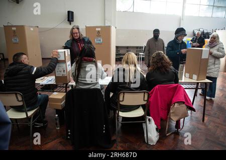 Buenos Aires, Argentina. 13th Aug, 2023. Voters cast their ballots at a polling station in Buenos Aires, Argentina, Aug. 13, 2023. Argentina held presidential primary elections on Sunday to elect the candidates for the general elections scheduled for Oct. 22. Credit: Martin Sabala/Xinhua/Alamy Live News Stock Photo