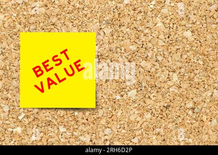 Yellow note paper with word value on cork board background with copy space Stock Photo