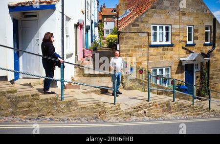 The pavements down to Robin Hood's Bay are steep and have many steps Stock Photo