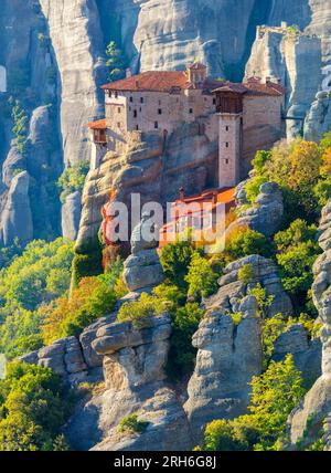 Unique Meteora monasteries. Zoom view on the Holy Roussanou Monastery placed on the edge  of high rock. The Meteora area is on UNESCO World Heritage. Stock Photo