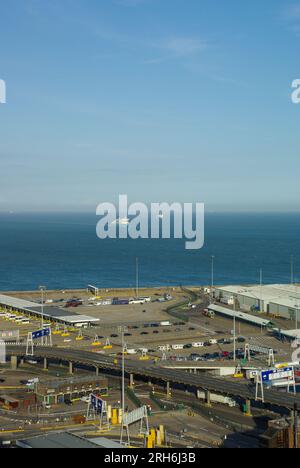 Port of Dover cross-channel port situated in Dover, Kent, England, UK. Clear sunny day looking across to France. Few vehicles waiting. Ferries far out Stock Photo