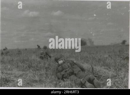 SS Photographer, Grönert, Hermann (Totenkopf, Russia and Italy 1943) Tiger I demonstration to Japanese officers; winter combat action with halftracks, flak gun mounted on halftrack, and StuG III;  Russian populace; many combat action photos of infantry in Russia with Tiger Is, StuG, Marder, and anti-tank guns; destroyed and captured Russian tanks; Russian prisoners of war; soldiers emplacing mines; assault guns and Tiger Is with infantry in Italy,  infantry training with mortars and a schwimmwagen crossing river Stock Photo