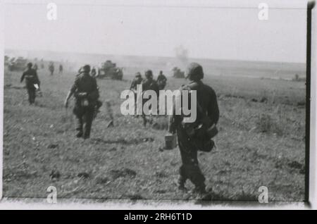 SS Photographer, Grönert, Hermann (Totenkopf, Russia and Italy 1943) Tiger I demonstration to Japanese officers; winter combat action with halftracks, flak gun mounted on halftrack, and StuG III;  Russian populace; many combat action photos of infantry in Russia with Tiger Is, StuG, Marder, and anti-tank guns; destroyed and captured Russian tanks; Russian prisoners of war; soldiers emplacing mines; assault guns and Tiger Is with infantry in Italy,  infantry training with mortars and a schwimmwagen crossing river Stock Photo