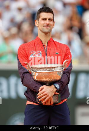 Serbian tennis player Novak Djokovic holding  the championship trophy is now the record holder with 23 Grand Slams after winning the men's singles fin Stock Photo