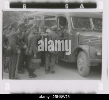 SS Photographer, Heiss (1943) Unit and soldiers in barracks, visit by Himmler with formal ceremony including Hitler Youth, unit movement by rail, soldiers manning an observation post in mountains, patrol in mountainous terrain and field activities, machine gun crew. Stock Photo