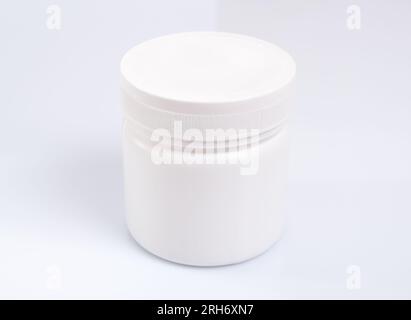 White Round plastic jar on white background Stock Photo