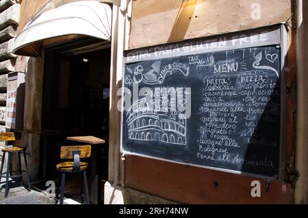 The menu of a restaurant seen in Rome, Italy, August 14 2023. Apparently, tourism and catering industries in Italy are hiking up prices and both Italians and tourists have noticed and started talking about. Last week, a couple complained on their social networks after they were charged of € 2 (2.19 USD) to have their sandwich cut in two at a restaurant. Few days after, an Italian couple eating in a pizzeria ordered a sweet course, which came with only one spoon.They asked for another one to share the dessert, and were charged of € 1.50 (1.60 USD) for the extra spoon. Cafés, hotels, pizzeri Stock Photo