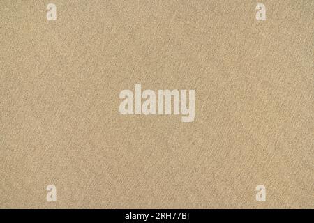 Brown sand on a beach in close-up, smooth fine texture Stock Photo