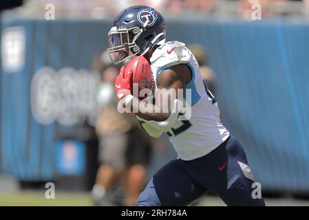 Tennessee Titans cornerback Armani Marsh 25 rusn with the ball