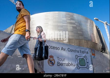 Madrid, Spain. 7th Aug, 2023. People are seen outside Real MadridÂ´s football stadium, Santiago Bernabeu, as it goes through the last stage of completing its new design and full renovation. The entire project has a reported cost of nearly â‚¬1 billion and is expected to be completed by the end of 2023. (Credit Image: © Xavi Lopez/SOPA Images via ZUMA Press Wire) EDITORIAL USAGE ONLY! Not for Commercial USAGE! Stock Photo