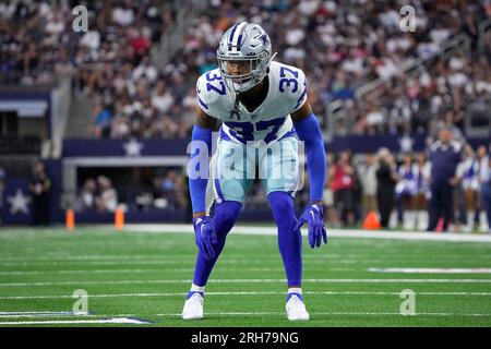 Dallas Cowboys wide receiver Tyron Johnson, left, can't hold on to a pass  while under pressure from cornerback Eric Scott Jr. during the NFL football  team's training camp Monday, July 31, 2023