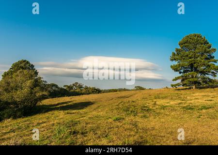 Lenticular cloud formation over landscape at Ronda Municipal Park in Sao Francisco de Paula, Brazil Stock Photo