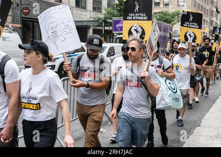 New York, USA. 14th Aug, 2023. WGA and SAG-AFTRA members continue to walk picket lines as they strike over contract negotiation at Netflix and Warner Bros. Discovery offices in New York on August 14, 2023. (Photo by Lev Radin/Sipa USA) Credit: Sipa USA/Alamy Live News Stock Photo