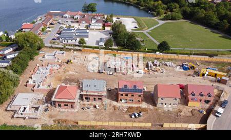 Drone aerial view from height of a fabulous new housing estate of quality houses under construction. Stock Photo