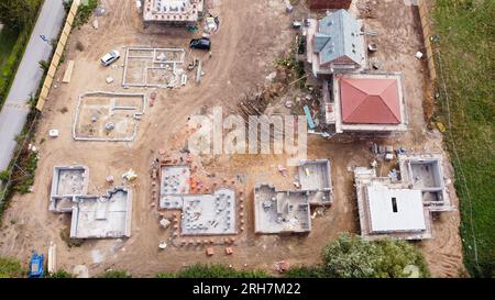 Top down drone aerial shot of quality new homes being built to create a new housing estate. Stock Photo