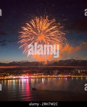Weymouth, Dorset, UK.  14th August 2023.  UK Weather.  View from the air of Monday night summer fireworks at the seaside resort of Weymouth in Dorset on a warm and calm evening.  Picture Credit: Graham Hunt/Alamy Live News Stock Photo