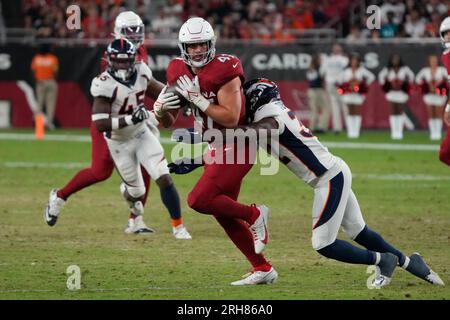 Arizona Cardinals linebacker Myjai Sanders (41) and Cardinals linebacker  Zaven Collins (25) celebrate a defensive stop against the Los Angeles  Chargers during the first half of an NFL football game in Glendale