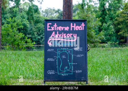 Extreme Heat Advisory Signboard showing locations of shelters and water fountains in Audubon Park in New Orleans, Louisiana, USA Stock Photo