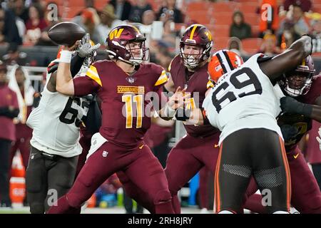 Washington Commanders quarterback Jake Fromm (11) looks to throw the ball  during an NFL pre-season football game against the Cleveland Browns,  Friday, Aug. 11, 2023, in Cleveland. (AP Photo/Kirk Irwin Stock Photo 