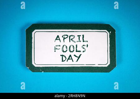 April Fool's Day. Sticky note with text on a blue background. Stock Photo