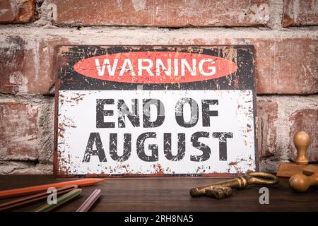 END OF AUGUST. Warning sign on wooden office desk Stock Photo Alamy